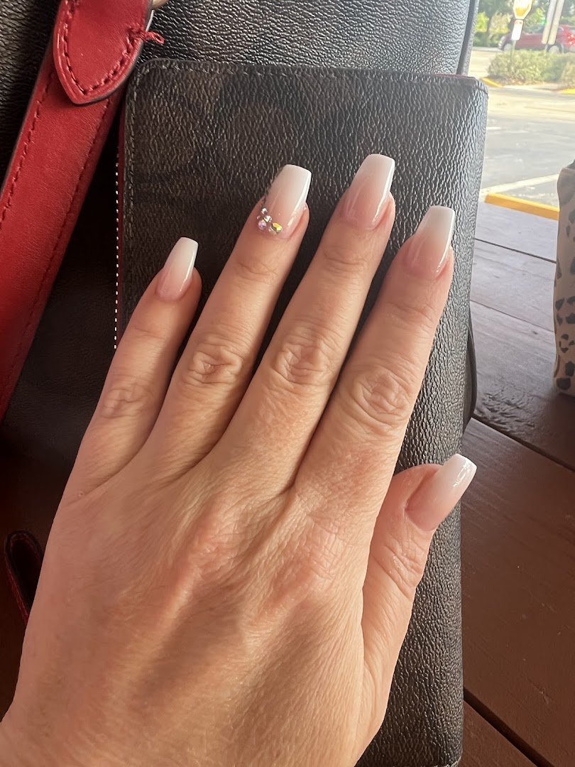 Nail salon manicure station with polish bottles